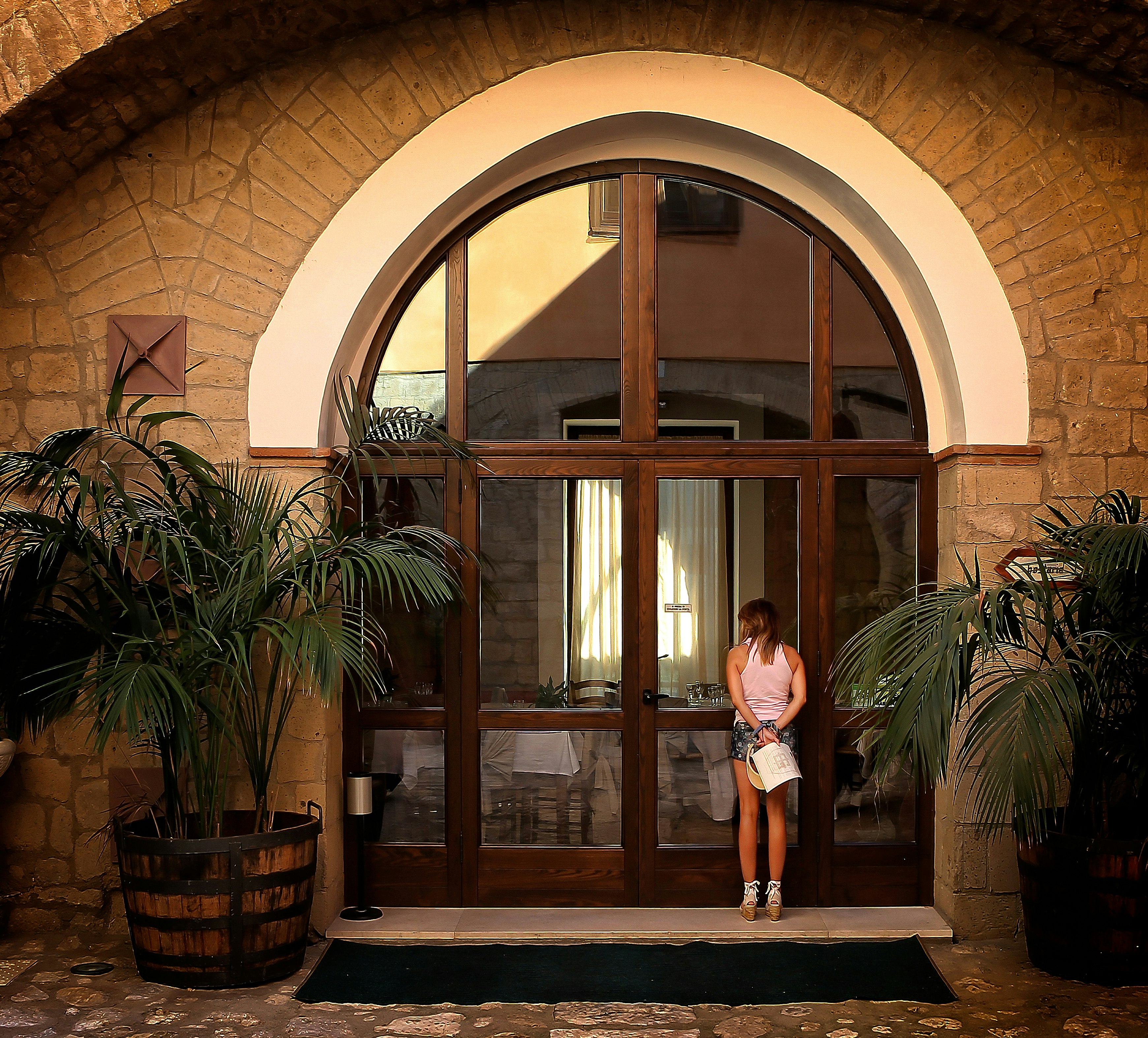 woman standing near the door